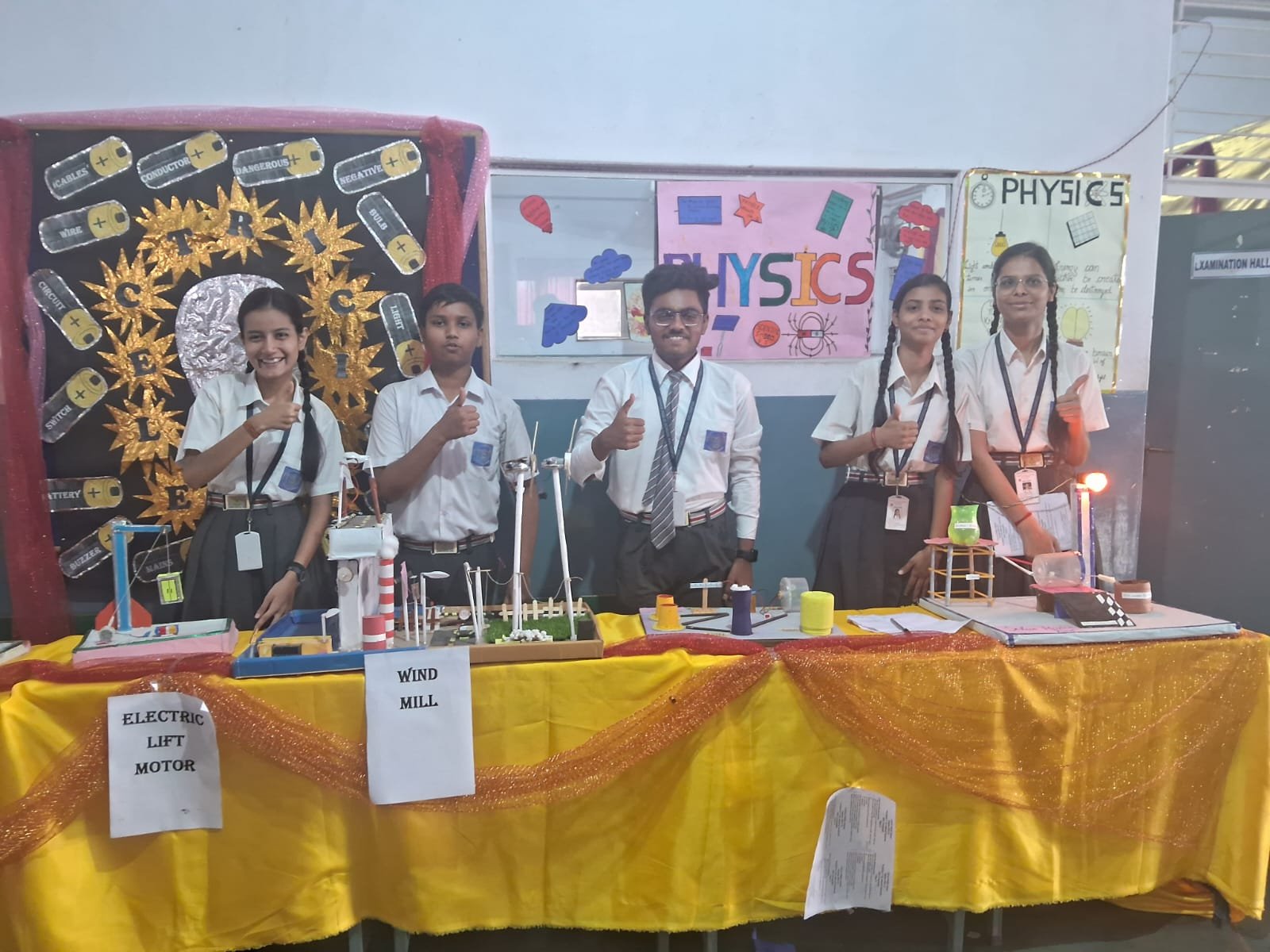 Students presenting working models at the science exhibition