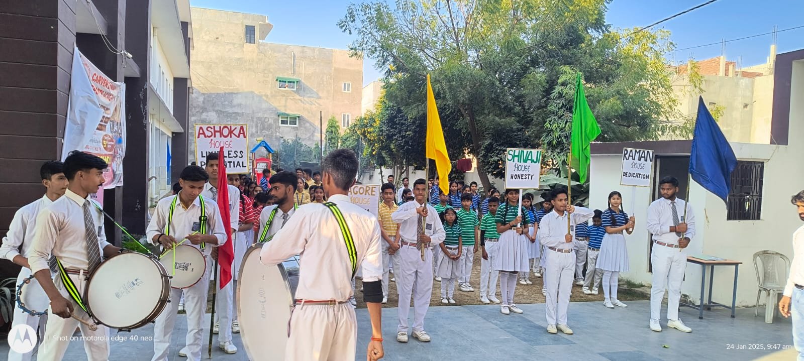 Students marching with house flags